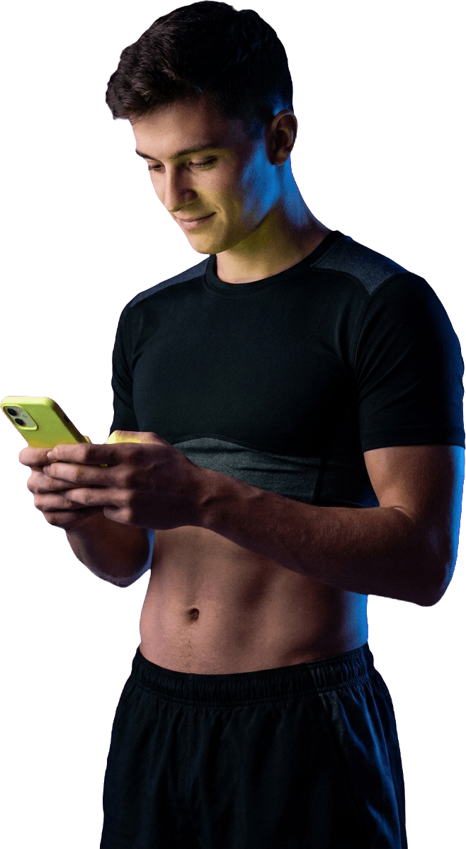 An athlete checking their NILAgent plan on a phone, the screen casting a volt-lime glow.