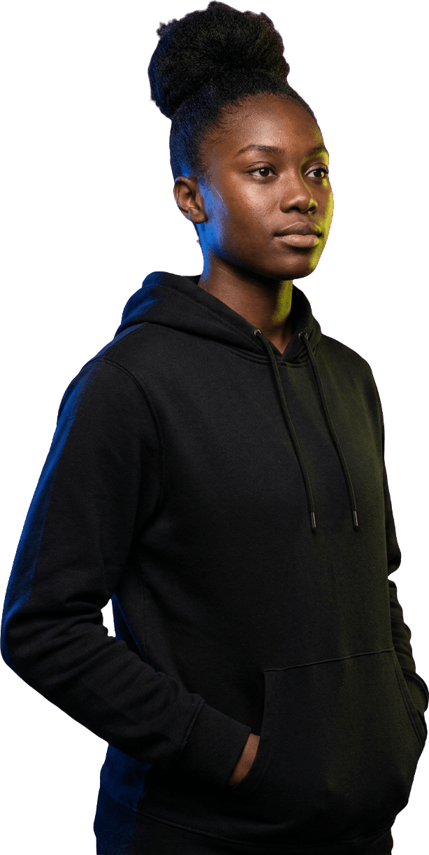 A young athlete in a plain black hoodie, calm and composed.